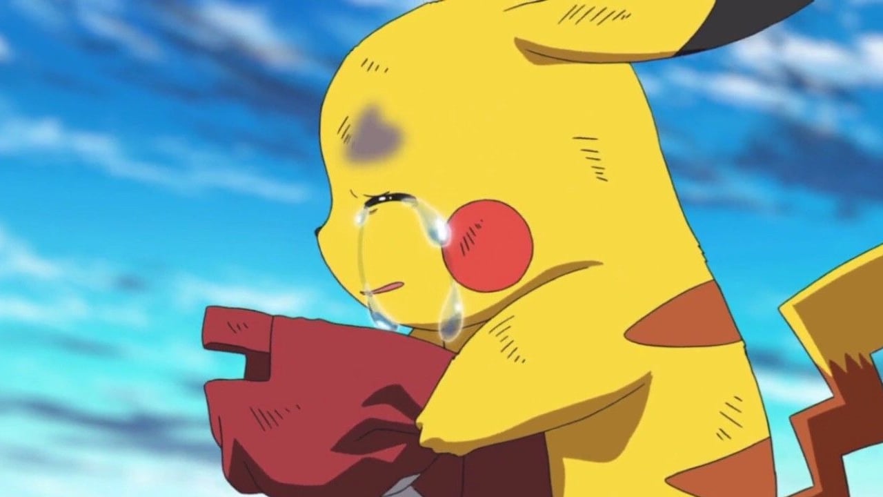 Pikachu crying while holding a hat