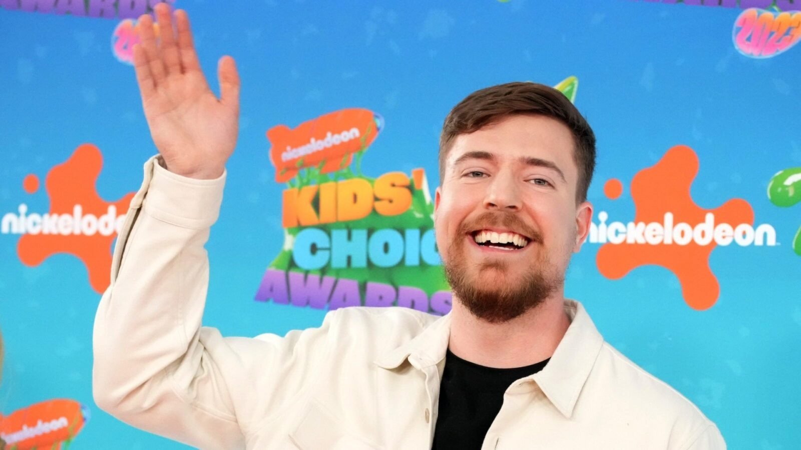 MrBeast waves at someone off-screen at the Kids Choice Awards