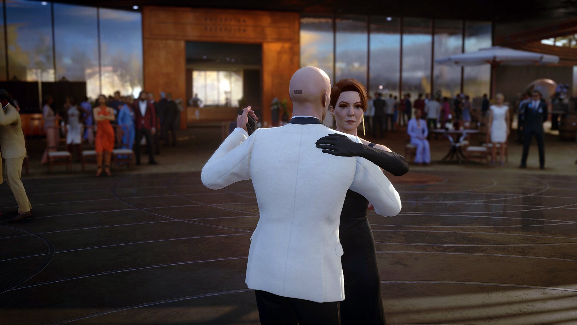 Agent 47 dances with his handler, Diana.