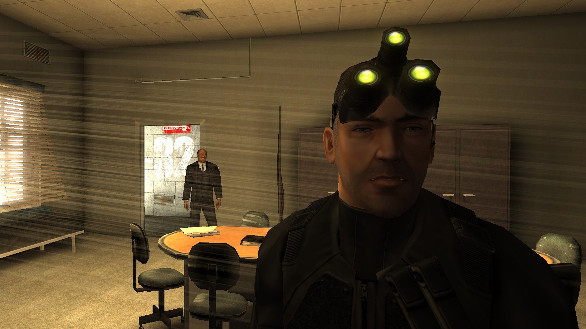 Lambert chats with Sam Fisher.