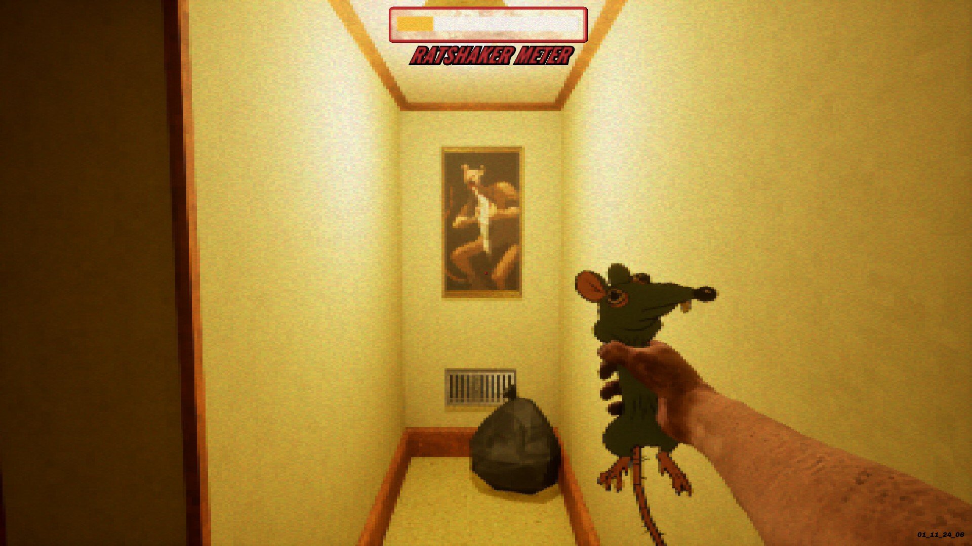 A man holds a rat in a hallway.