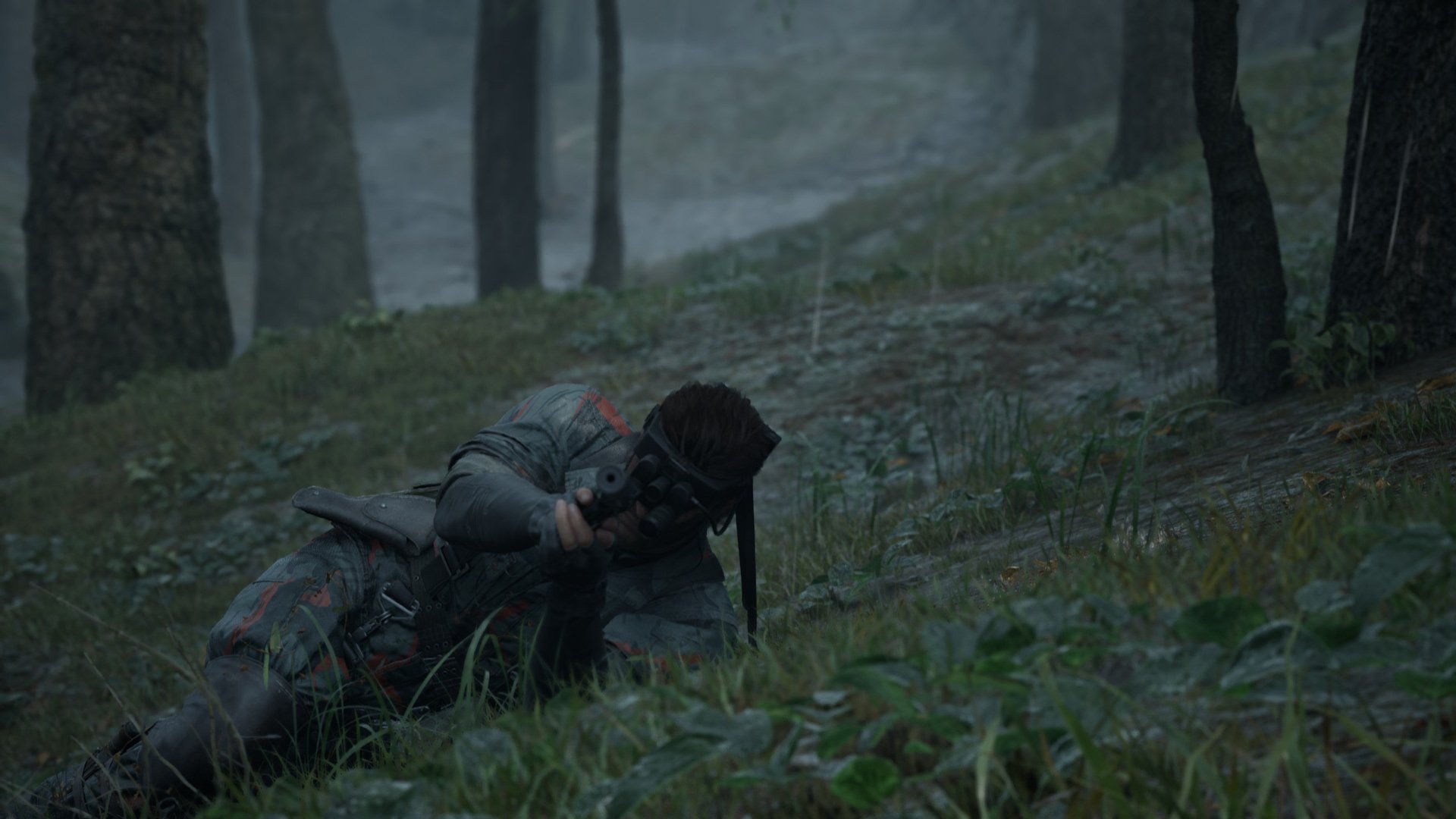 Snake lays in the grass while lining up a shot.