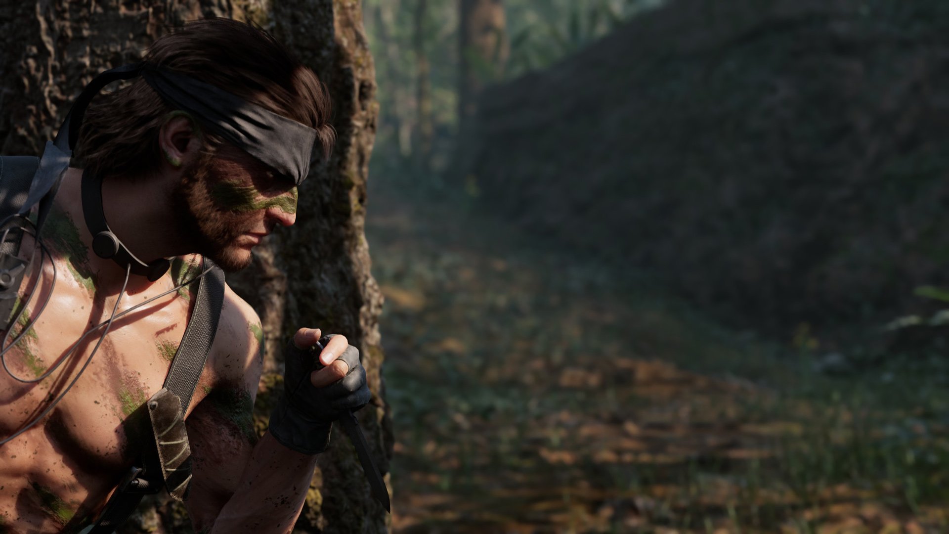 Snake hides behind a tree without wearing a shirt.