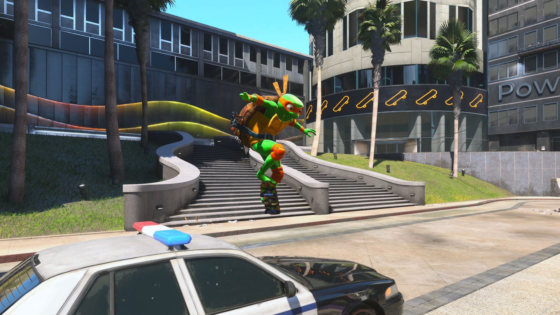 Michelangelo ollies over a police car.